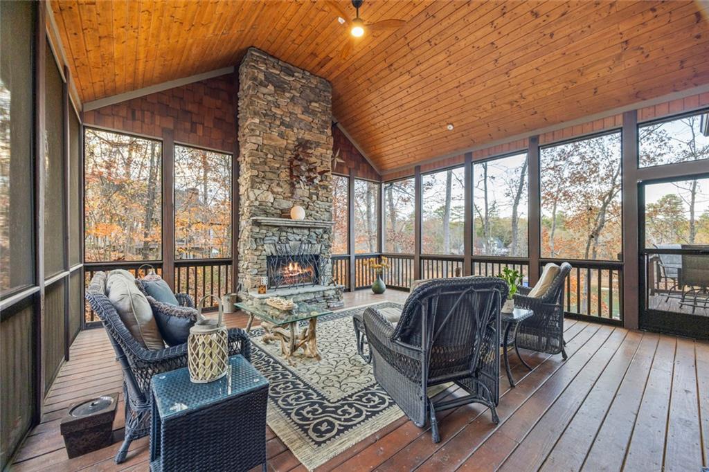 152 Chapman Manor Drive Martin, GA 30557 - Photo 49 of 90 a living room with furniture and floor to ceiling windows