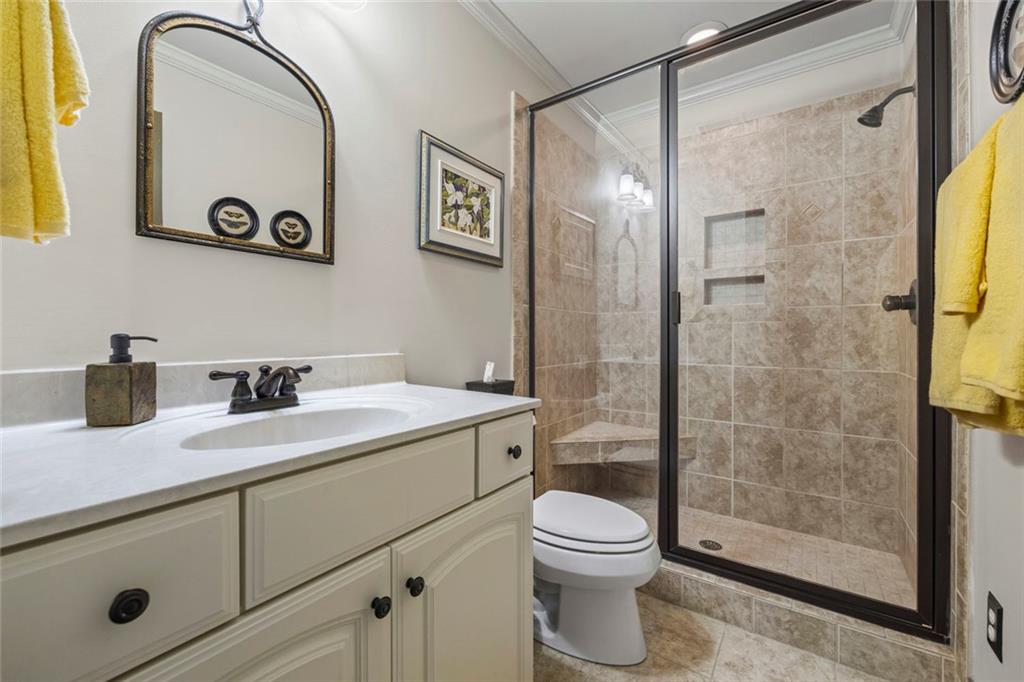 152 Chapman Manor Drive Martin, GA 30557 - Photo 61 of 90 a bathroom with a granite countertop sink a toilet and shower