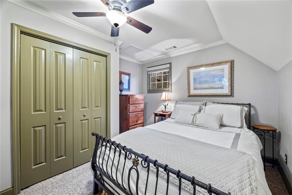 152 Chapman Manor Drive Martin, GA 30557 - Photo 65 of 90 a bed room with a bed and a chandelier