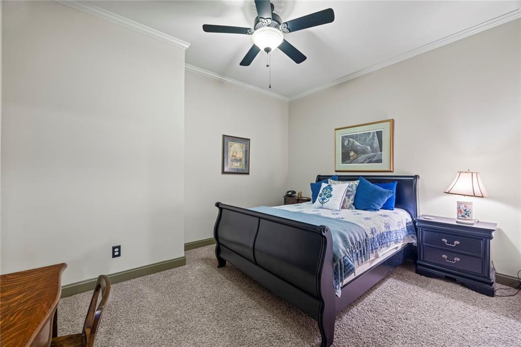 152 Chapman Manor Drive Martin, GA 30557 - Photo 79 of 90 a bedroom with a bed and a chandelier