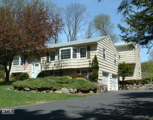 24 Nutmeg Court Ridgefield, CT 06877 - Photo 1 of 1 a front view of a house with a yard