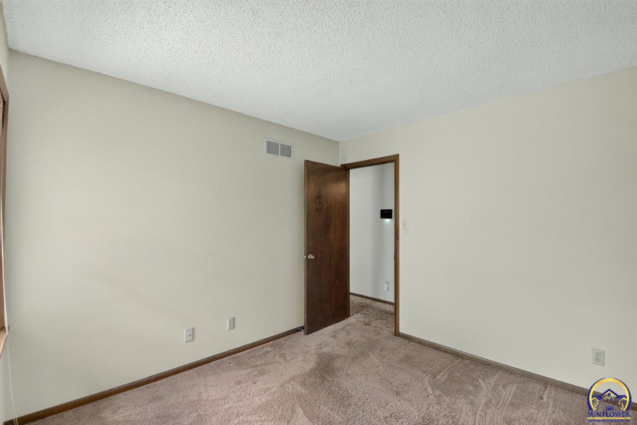 5701 Southwest Arrowhead Court Topeka, KS 66614 - Photo 27 of 36 Bedroom 3