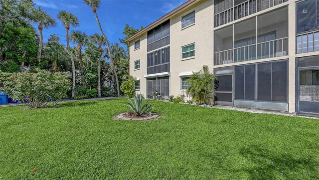 a view of a backyard with sitting area