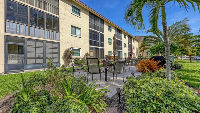 a view of a backyard with plants and a backyard
