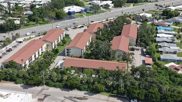 an aerial view of residential houses with outdoor space