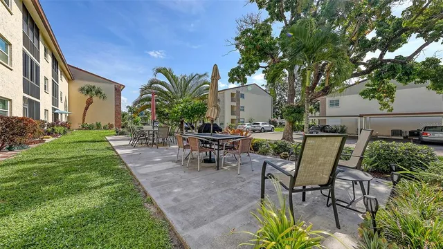 a view of a patio with couches and potted plants