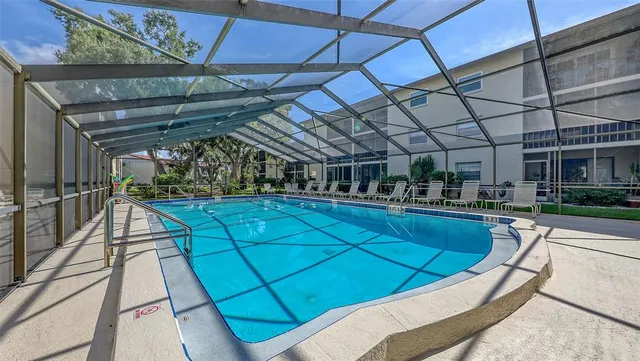 a view of a swimming pool with a patio