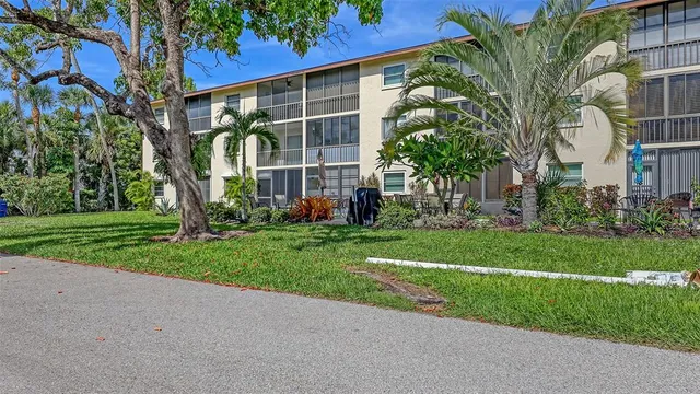 an aerial view of residential houses with city view