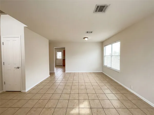 a view of an empty room and window