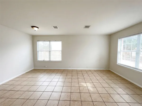a view of an empty room and window