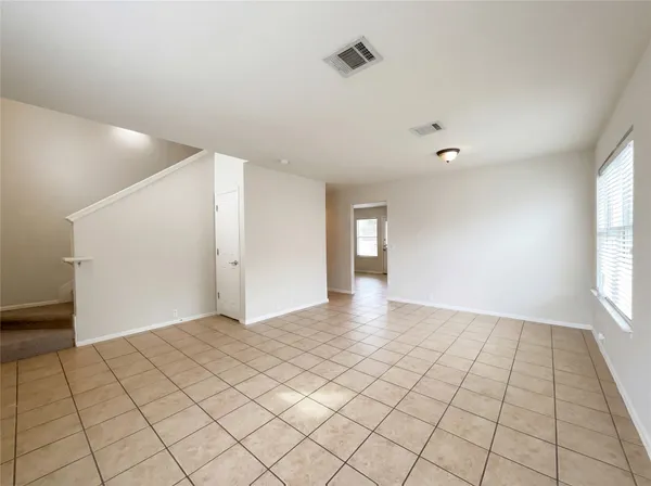 a view of an empty room and window