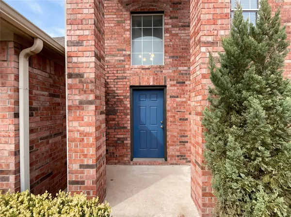 a front view of a house with a garage