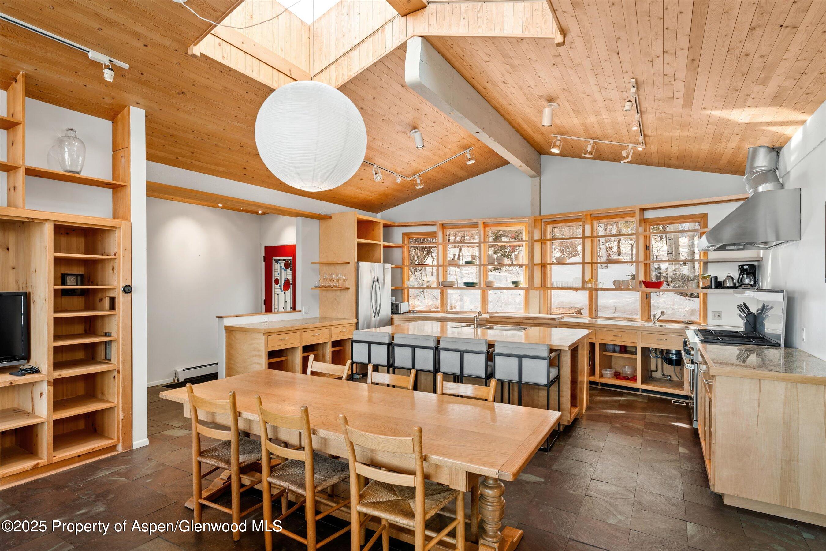 328 Oak Ridge Road Snowmass Village, CO 81615 - Photo 12 of 44 a view of a dining room with furniture window and wooden floor