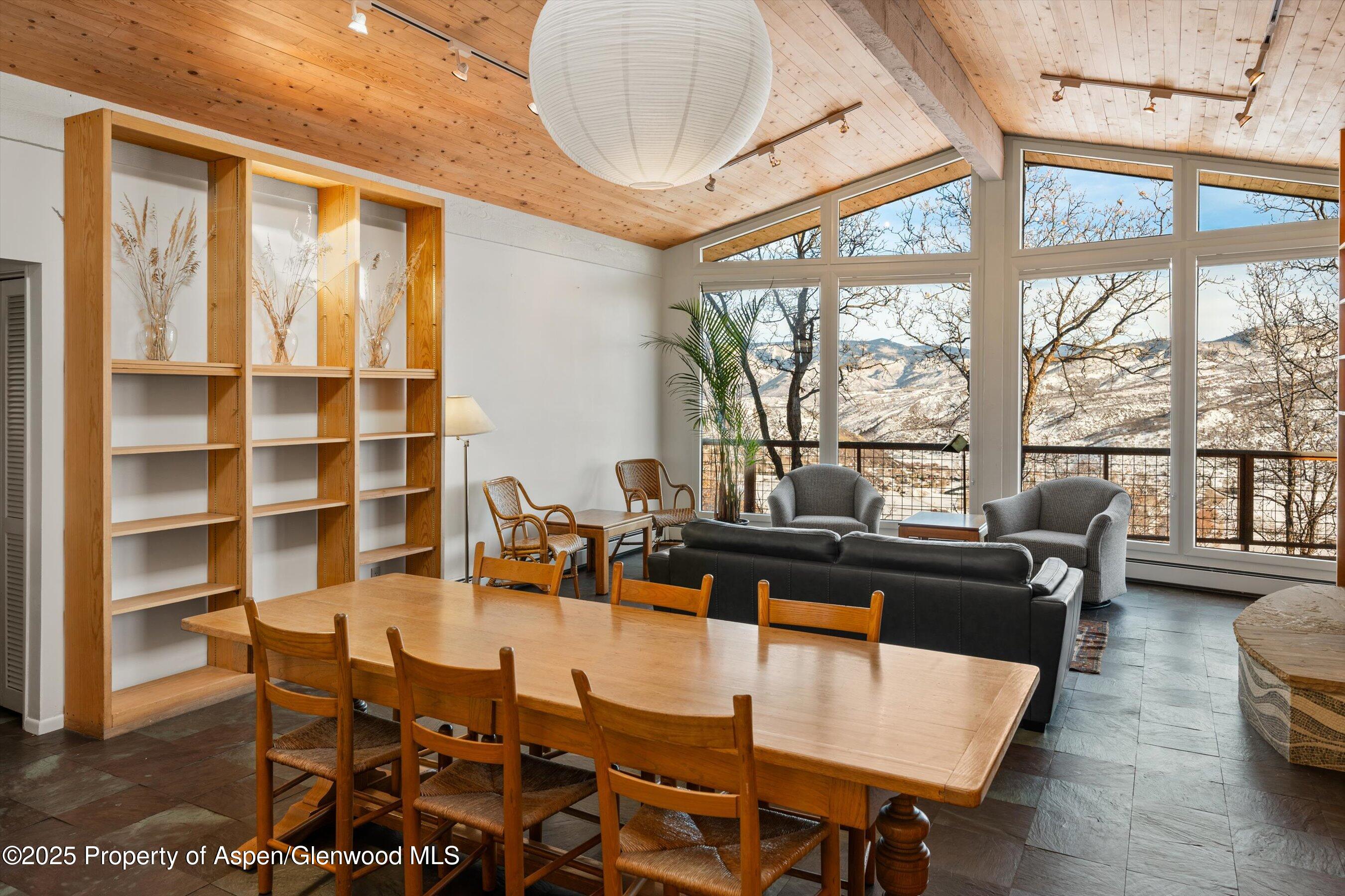 328 Oak Ridge Road Snowmass Village, CO 81615 - Photo 13 of 44 a dining room with furniture and wooden floor