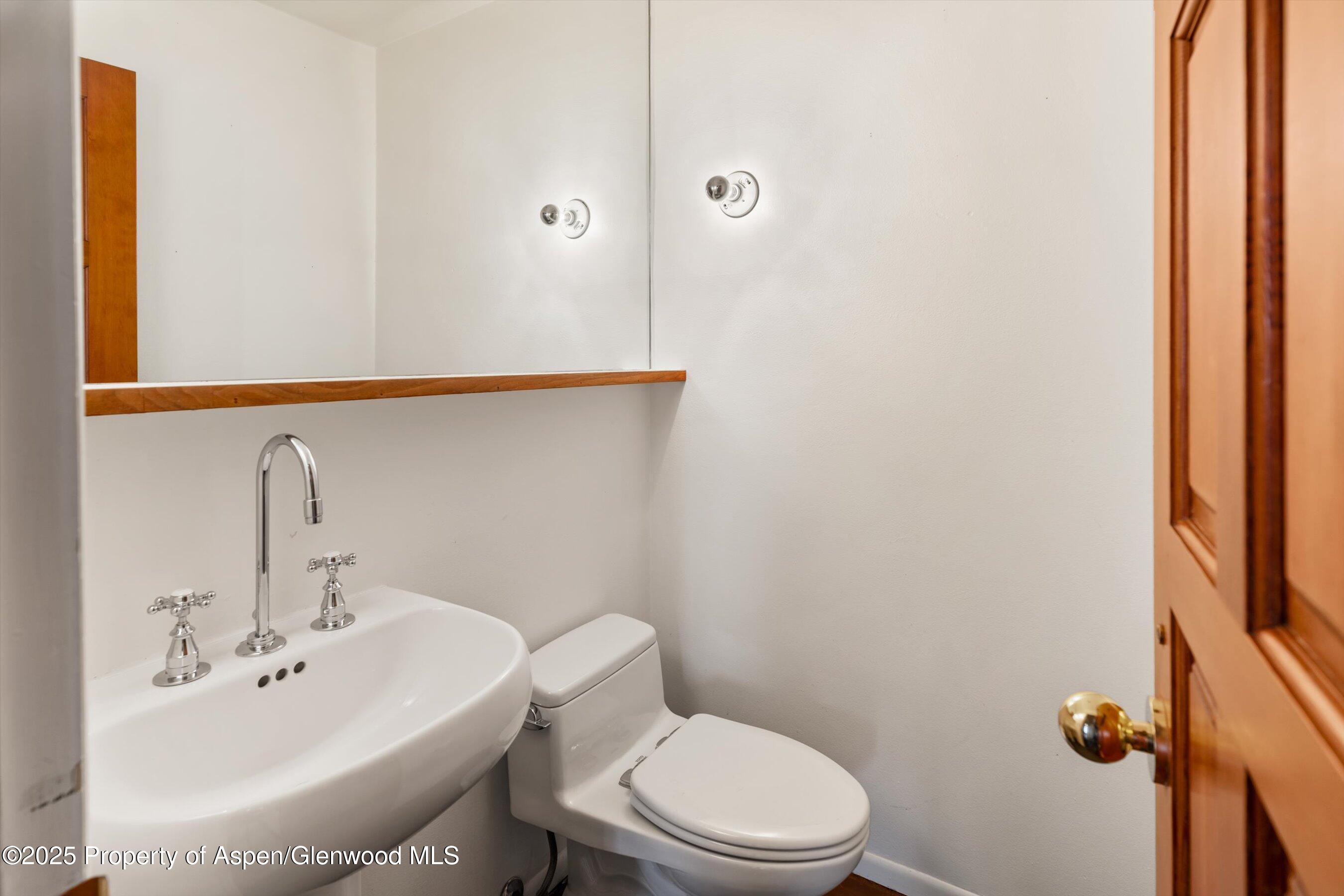328 Oak Ridge Road Snowmass Village, CO 81615 - Photo 29 of 44 a bathroom with a sink a mirror and a toilet