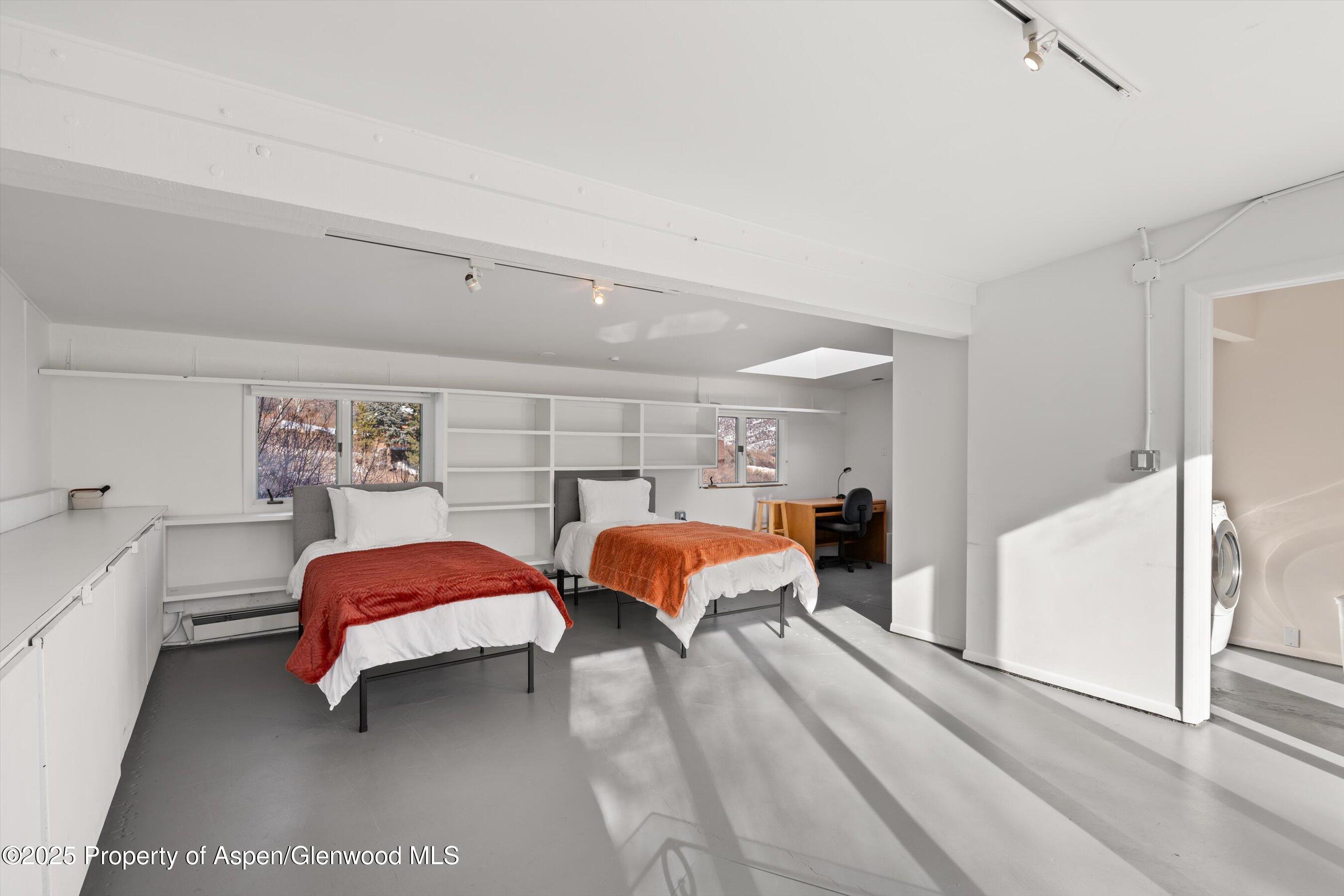 328 Oak Ridge Road Snowmass Village, CO 81615 - Photo 32 of 44 a bedroom with a bed and window