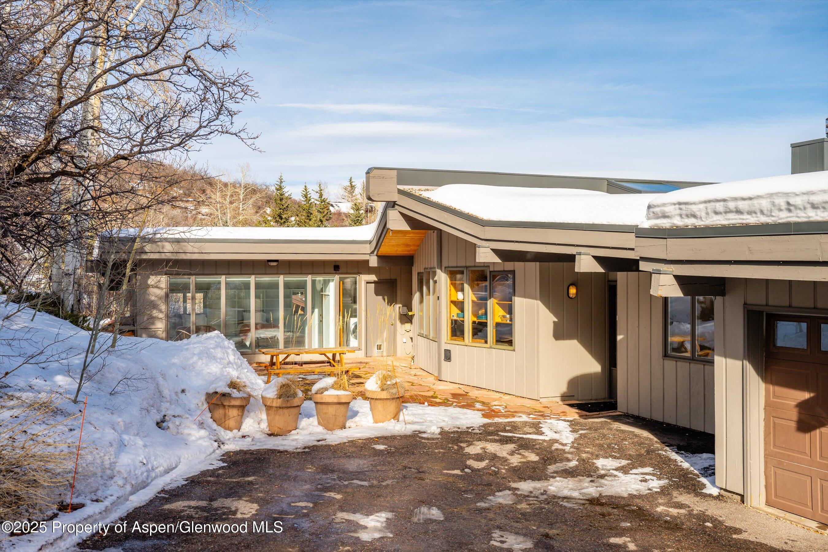 328 Oak Ridge Road Snowmass Village, CO 81615 - Photo 36 of 44 a view of a building with a porch