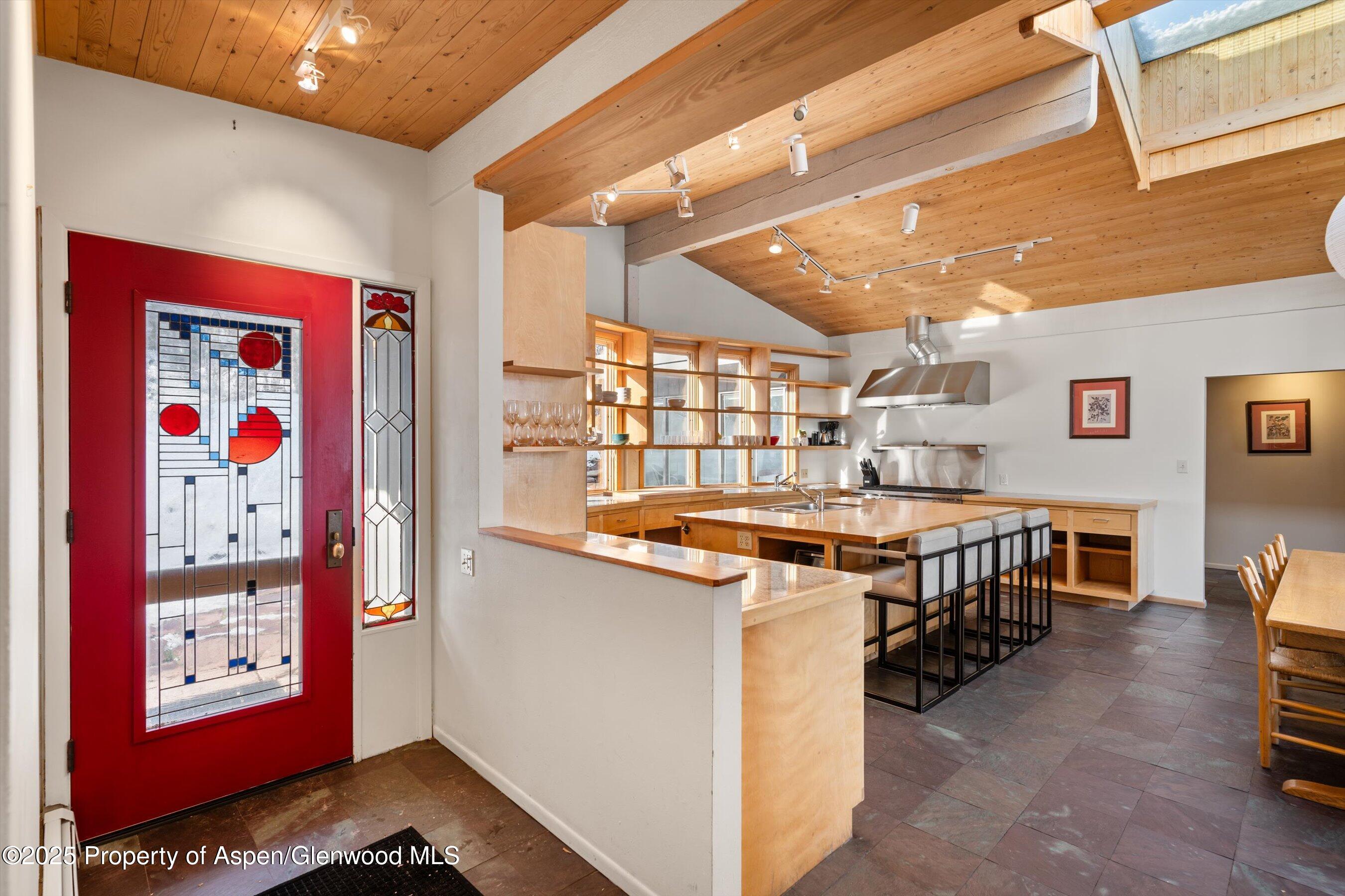 328 Oak Ridge Road Snowmass Village, CO 81615 - Photo 38 of 44 a kitchen with stainless steel appliances granite countertop a stove and a refrigerator
