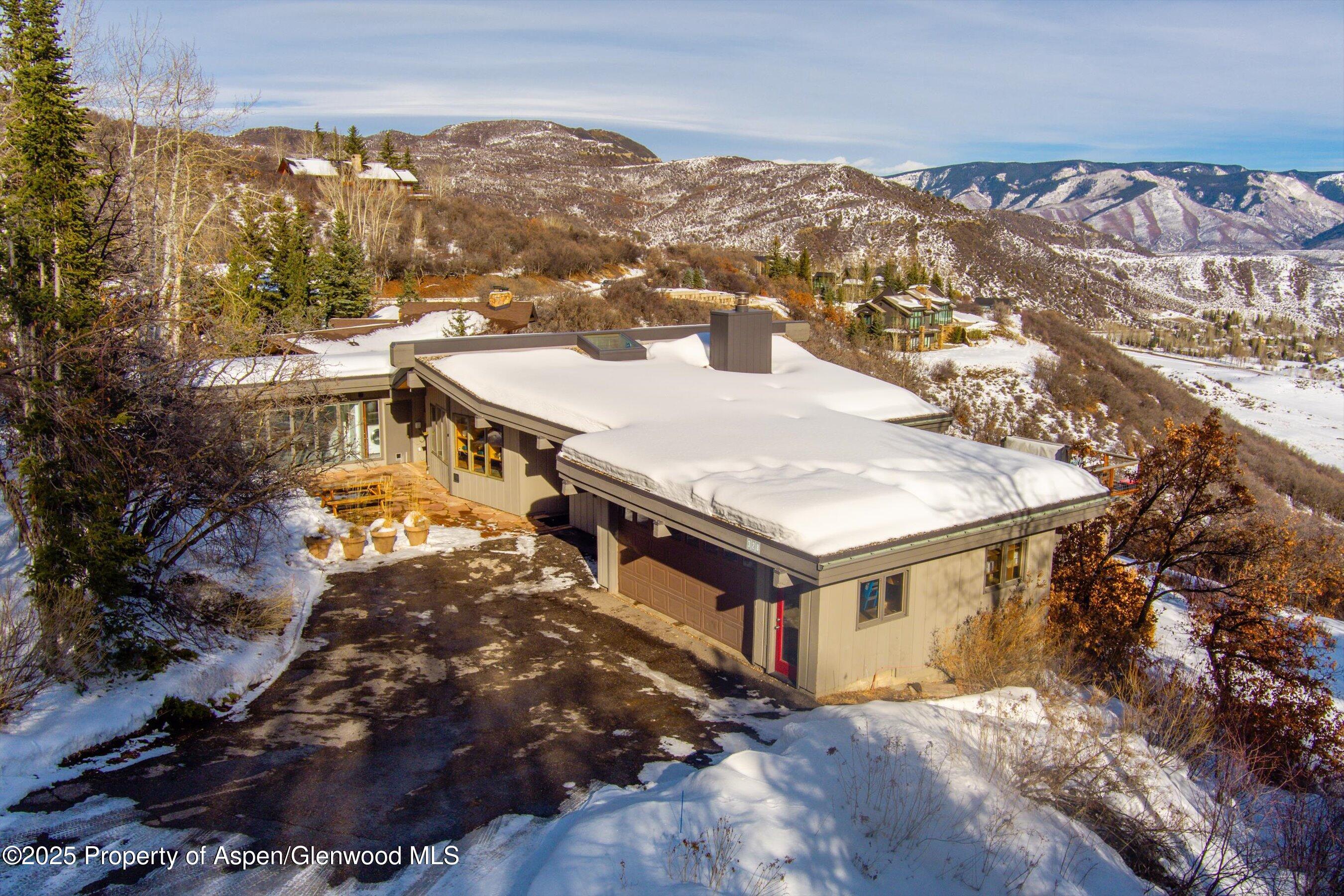 328 Oak Ridge Road Snowmass Village, CO 81615 - Photo 41 of 44 a view of a city from a terrace