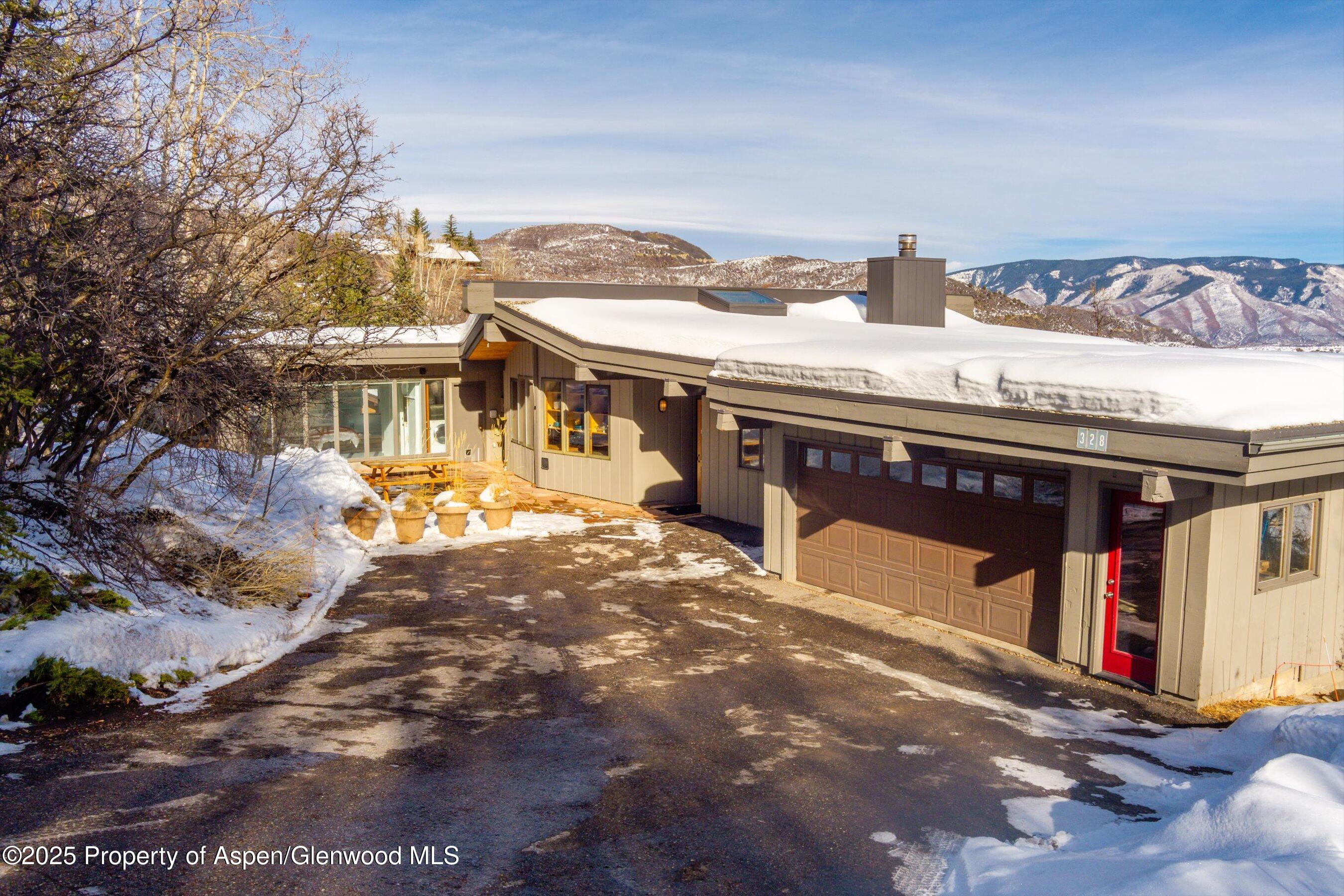 328 Oak Ridge Road Snowmass Village, CO 81615 - Photo 42 of 44 a view of a house with a outdoor space