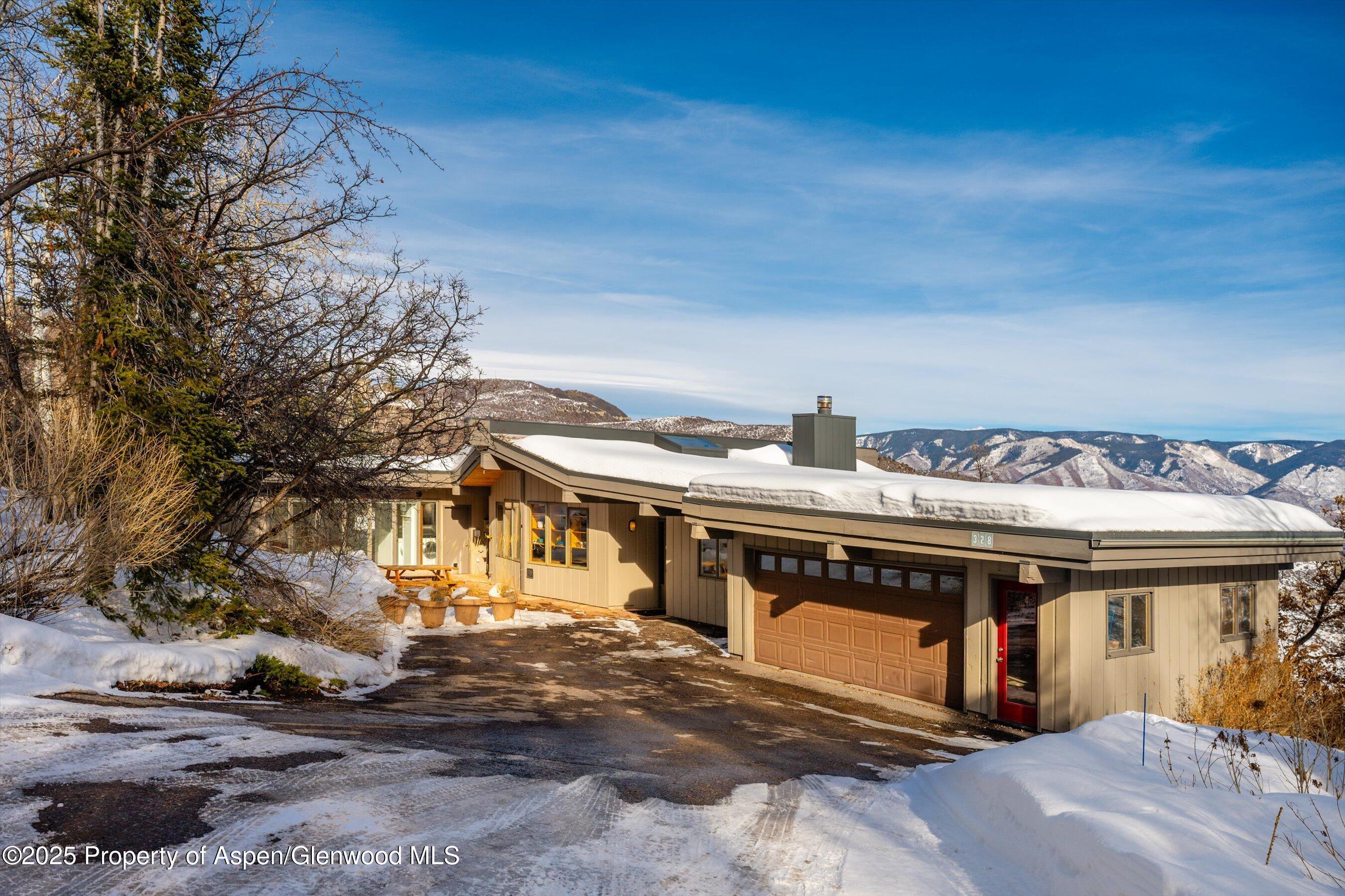 328 Oak Ridge Road Snowmass Village, CO 81615 - Photo 6 of 44 a view of a house with a balcony