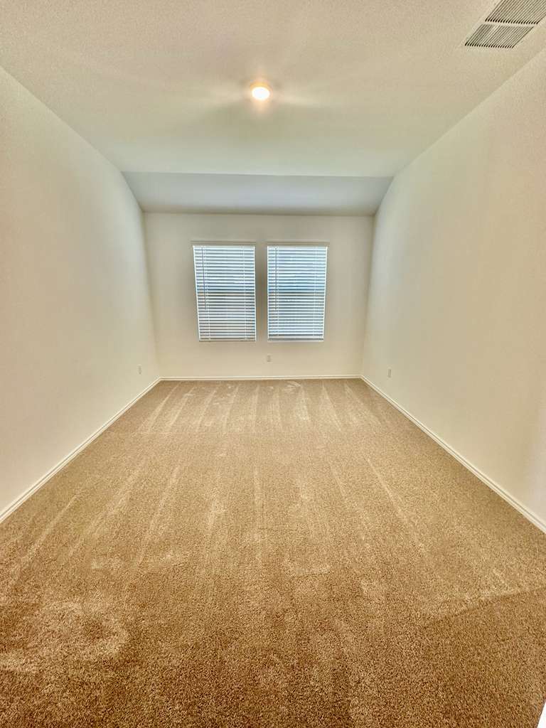 4104 Home Pl Road Georgetown, TX 78628 - Photo 14 of 35 Unfurnished room with carpet floors and baseboards