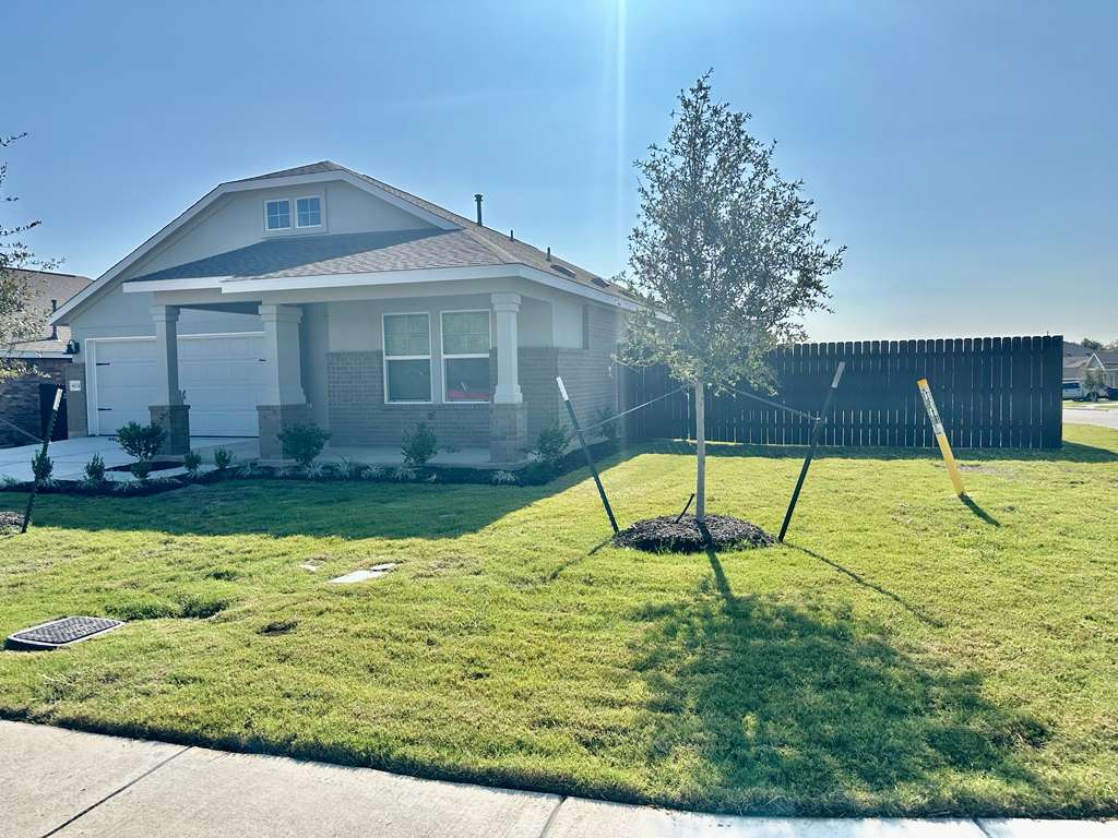 4104 Home Pl Road Georgetown, TX 78628 - Photo 2 of 35 View of front of property featuring brick siding and an attached garage