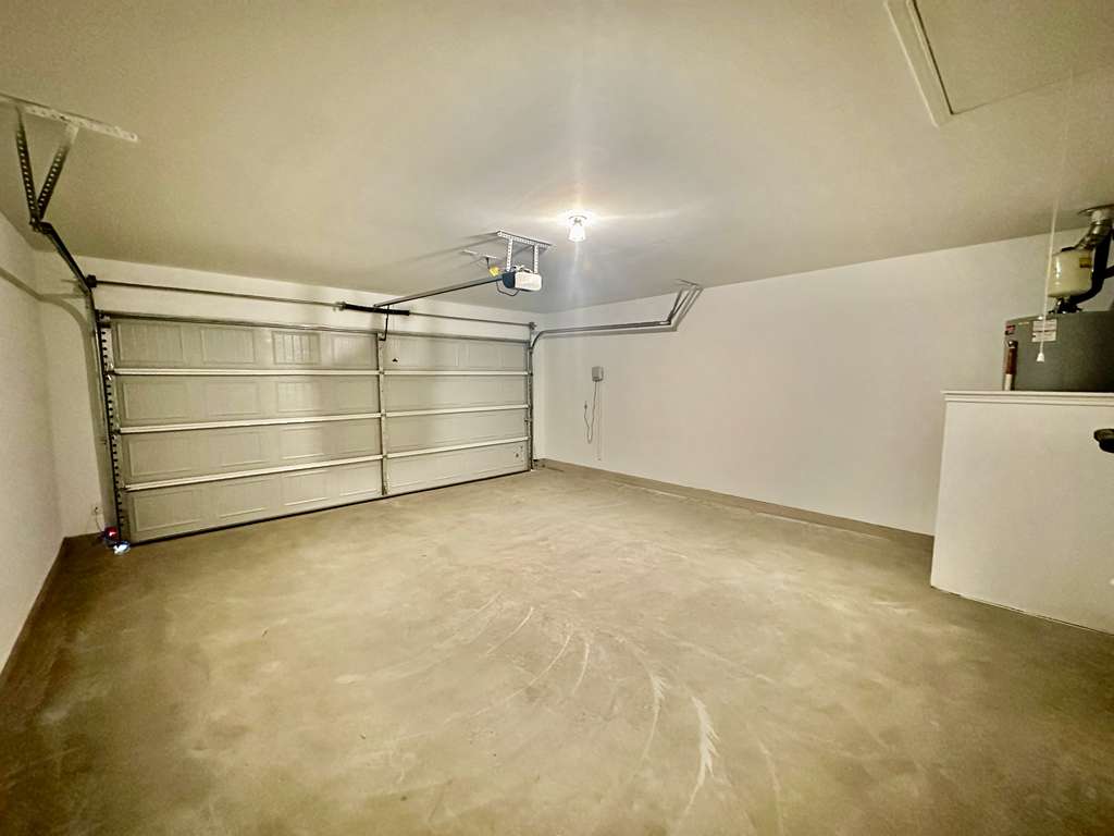 4104 Home Pl Road Georgetown, TX 78628 - Photo 5 of 35 Garage featuring water heater