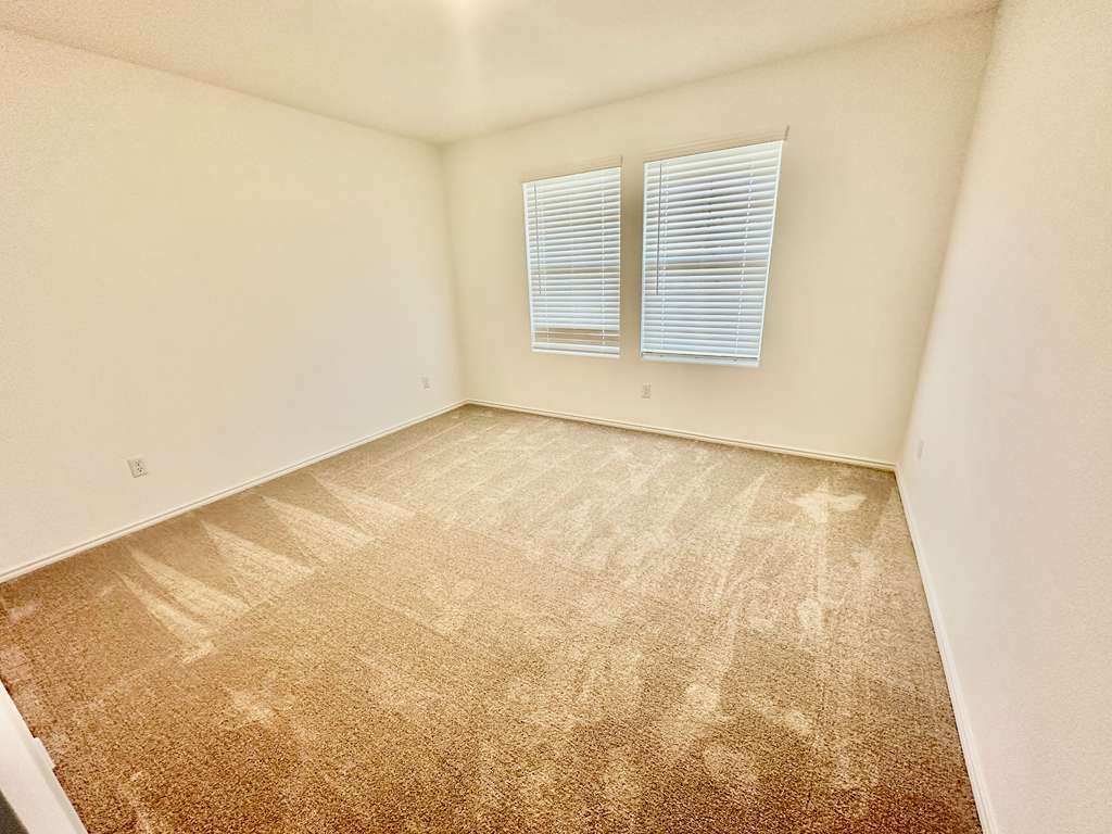 4104 Home Pl Road Georgetown, TX 78628 - Photo 7 of 35 Carpeted spare room with baseboards