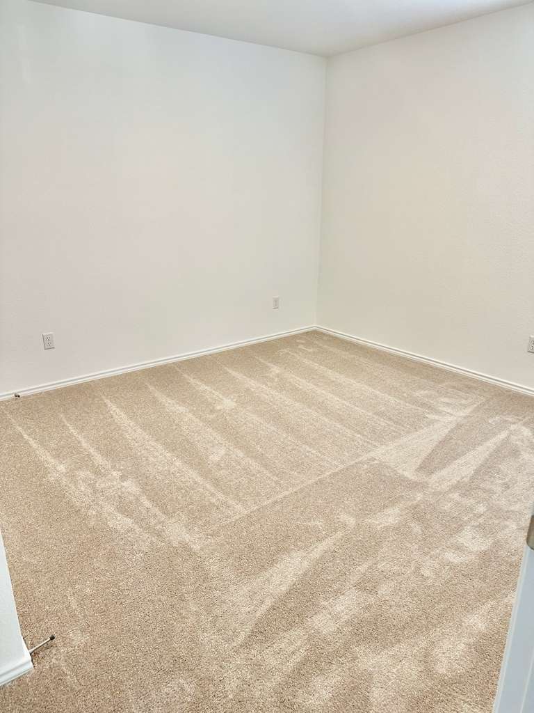 4104 Home Pl Road Georgetown, TX 78628 - Photo 9 of 35 Unfurnished room featuring carpet floors and baseboards