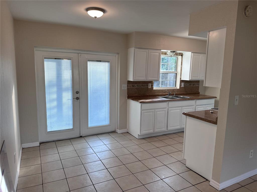 5772 94th Avenue Pinellas Park, FL 33782 - Photo 12 of 29 a kitchen with a stove a sink and a refrigerator