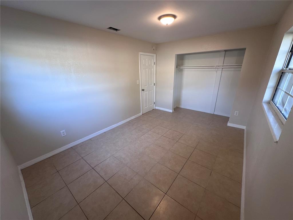 5772 94th Avenue Pinellas Park, FL 33782 - Photo 22 of 29 an empty room with windows