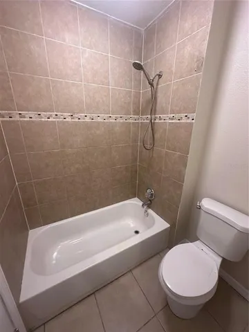 a bathroom with a sink toilet and mirror