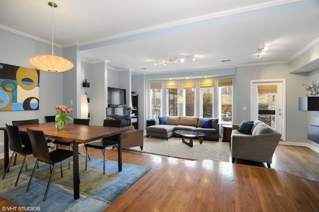 69 East 16th Street, Unit 2 Chicago, IL 60616 - Photo 2 of 16 a living room with furniture and a large window