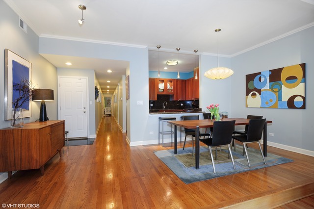69 East 16th Street, Unit 2 Chicago, IL 60616 - Photo 6 of 16 a living room with furniture and kitchen view