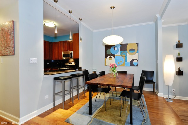 69 East 16th Street, Unit 2 Chicago, IL 60616 - Photo 7 of 16 a view of a dining room with furniture and wooden floor