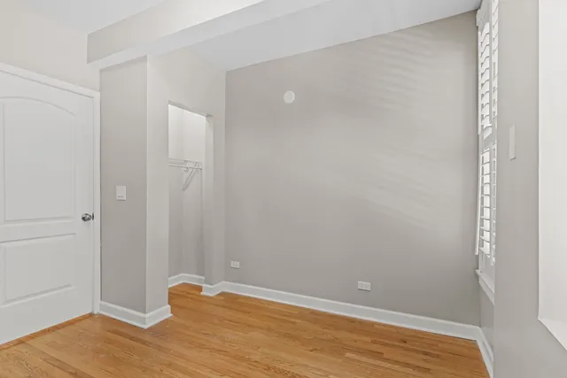 a view of room with wooden floor