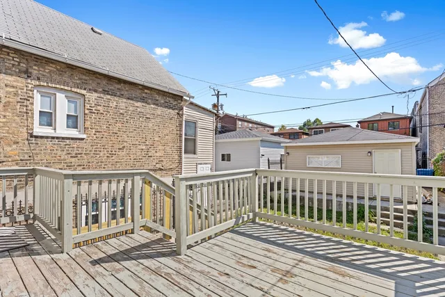 a view of a balcony with wooden floor