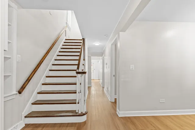 a view of entryway with wooden floor