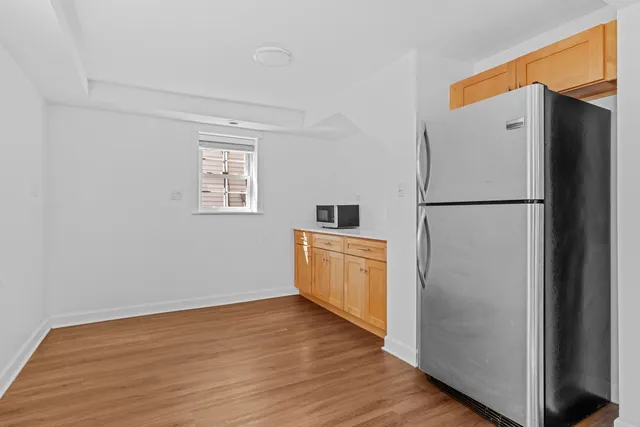 a white refrigerator freezer sitting in a kitchen
