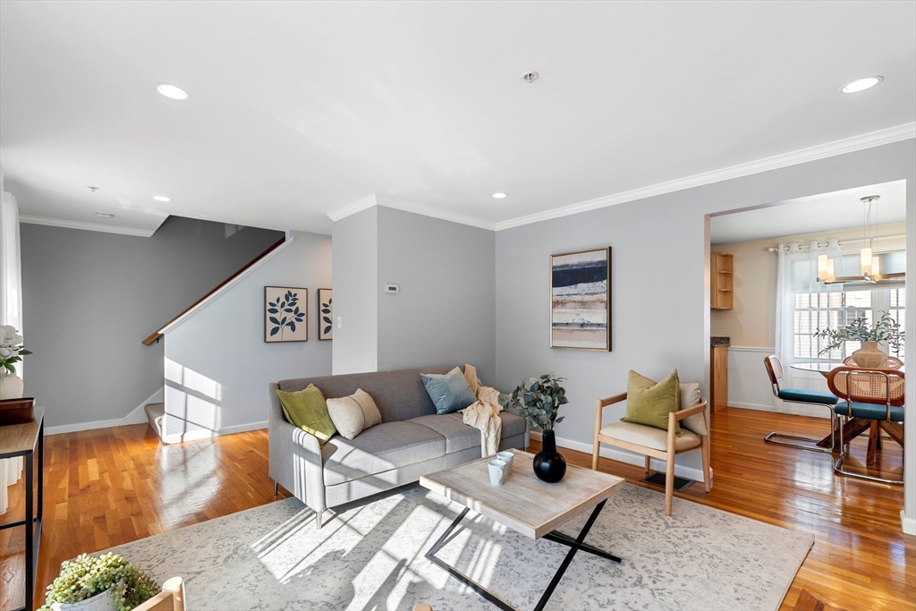 1005 Trapelo Road, Unit 8 Waltham, MA 02452 - Photo 7 of 24 a living room with furniture and wooden floor