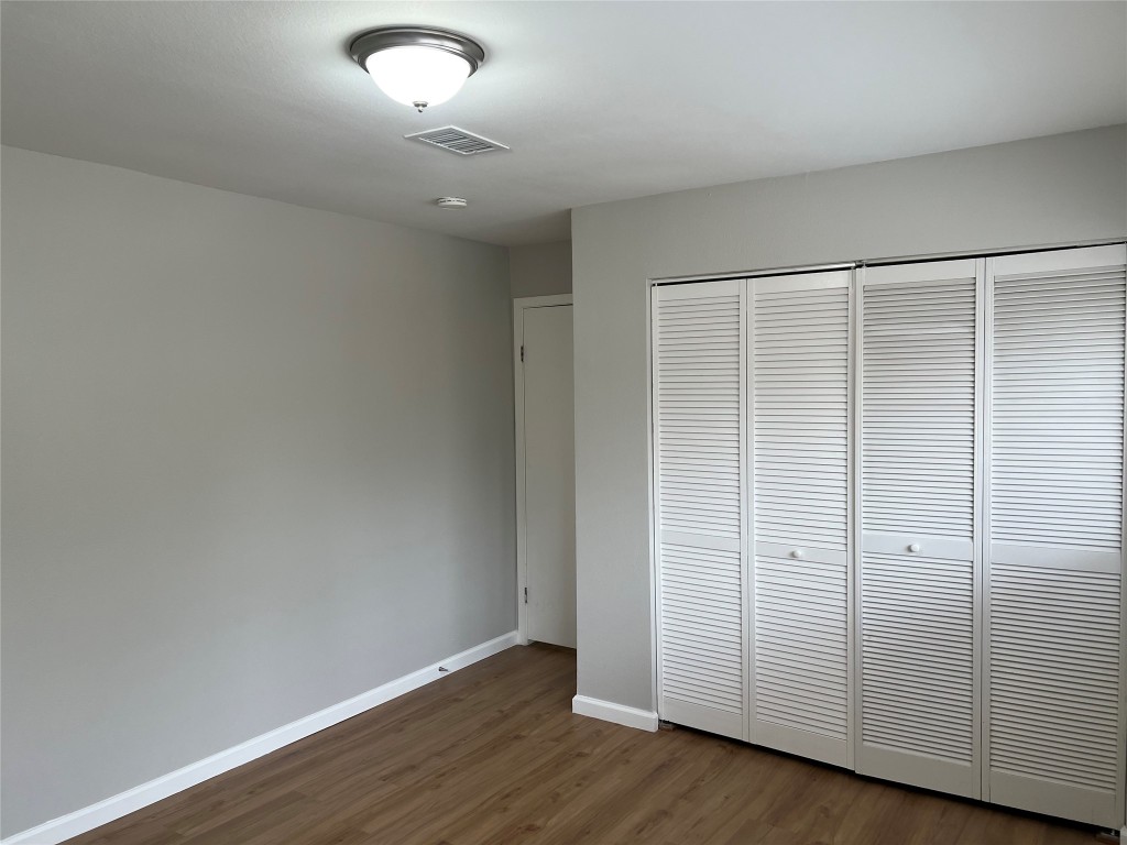 65 Yewleaf Road The Woodlands, TX 77381 - Photo 19 of 21 wooden floor in an empty room