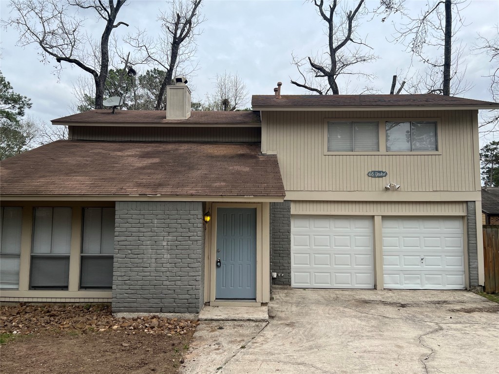 65 Yewleaf Road The Woodlands, TX 77381 - Photo 21 of 21 a view of a stone house with large windows