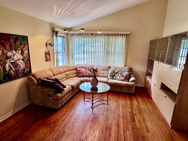a living room with furniture and a large window