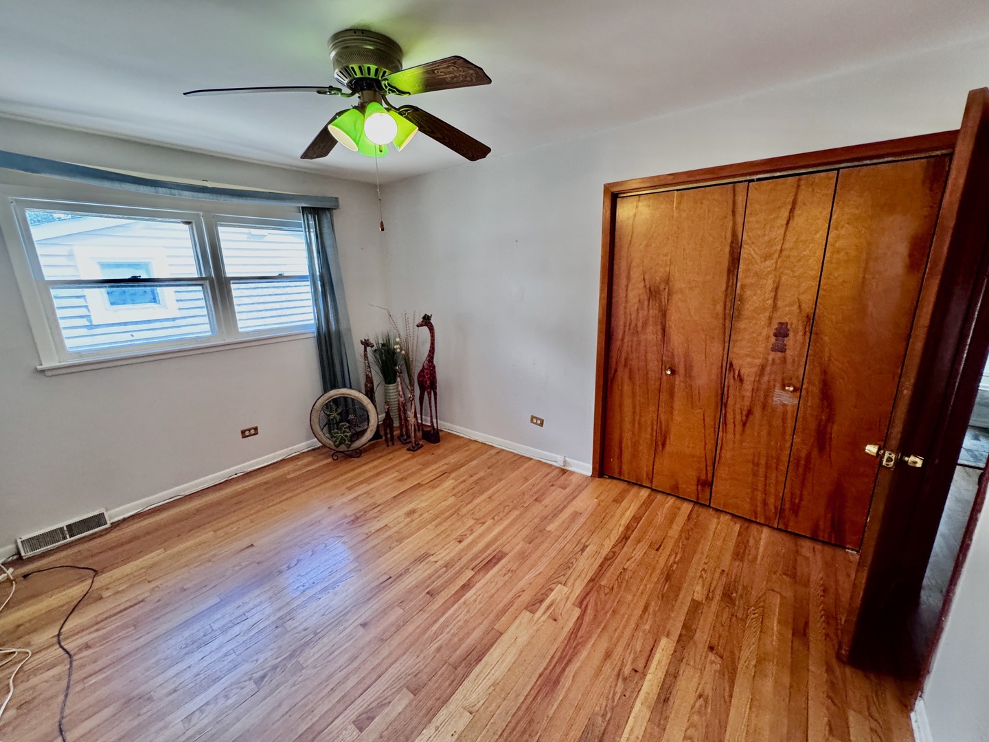 597 Lowden Avenue Glen Ellyn, IL 60137 - Photo 9 of 15 a bedroom with a bed and a window