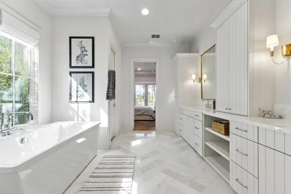 a living room with a large window and a glass door