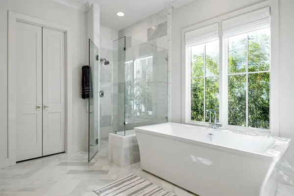 a spacious bathroom with a double vanity sink and a mirror