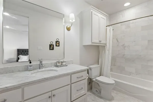 a living room with furniture and a rug