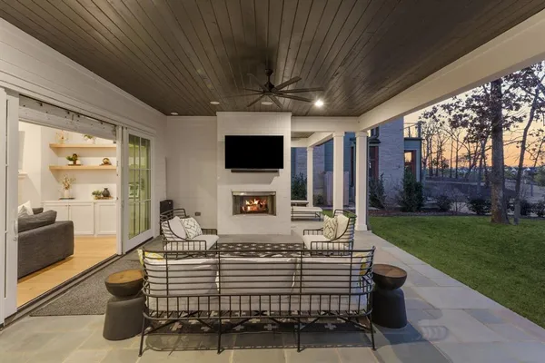 a kitchen with white cabinets and a sink