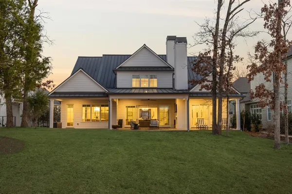 a view of a house with a yard and plants